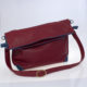 sac en cuir rouge brique et bleu, cuir souple et moelleux, grand sac, bandoulière avec boucle à coulisse, plusieurs anneaux d'attache, face, fermé en pochette